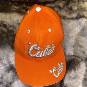 Orange “cutie” ball cap